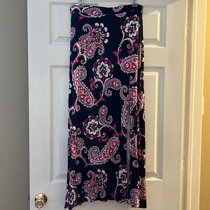 Maxi skirt with elastic waist band. Slit in front comes to about mid thigh.